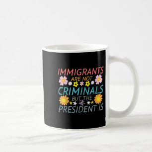 Migranten zijn geen criminelen, maar het President Koffiemok