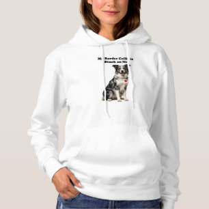 Mijn blauwe merle bordercollie zit vast aan mij hoodie