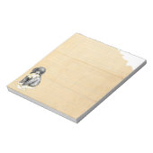 Mijn miniatuurpoot over mijn thuiswerk notitieblok (Linkerzijde)