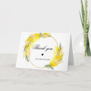 Mimosa bloemen en groene bladeren kaart