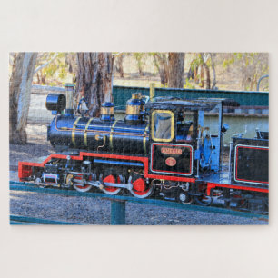 Miniatuur zwart stoomtreinmotor  legpuzzel