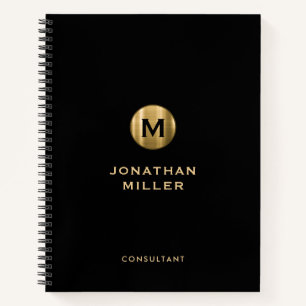 Minimaal zwart goudgeborsteld metalen monogram notitieboek
