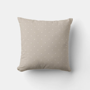 Minimale witte stippen op koele beige grijstint kussen