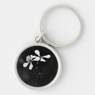 minimale zwart-wit bloemmotief sleutelhanger