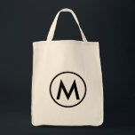 Minimale zwarte Elegant Monogram Tote Bag<br><div class="desc">Dit moderne ontwerp van de canvas tas biedt een minimalistisch elegant monogram met uw initiaal in vetgedrukte zwarte tekst voor een eenvoudige en professionele uitstraling.</div>