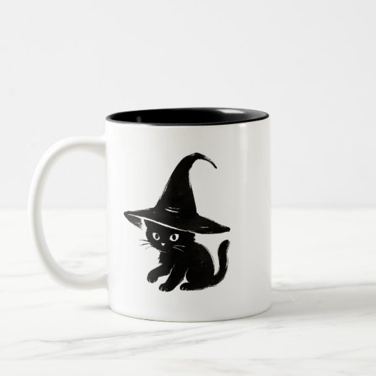 Minimalist Black Cat with Witch Hat Design on Tweekleurige Koffiemok (Links)