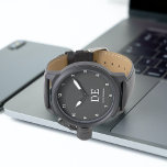 Minimalistisch modern zwart-wit monogram horloge<br><div class="desc">Dit moderne ontwerp heeft typografische initialen en naam voor een minimalistisch gevoel dat gemakkelijk kan worden gepersonaliseerd.</div>