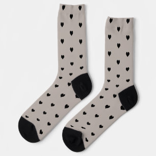 Minimalistisch zwart hartpatroon op beige achtergr sokken