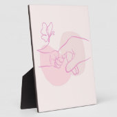 Minimalistische Baby-hand die de bovenliggende vin Fotoplaat (Zijkant)