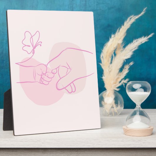 Minimalistische Baby-hand die de bovenliggende vin Fotoplaat (Zijkant)