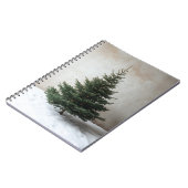 Minimalistische kerstboom met zachte lichten op sn notitieboek (Linkerzijde)