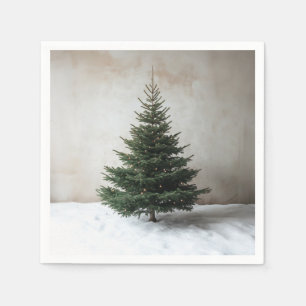Minimalistische kerstboom met zachte lichten op sn servet