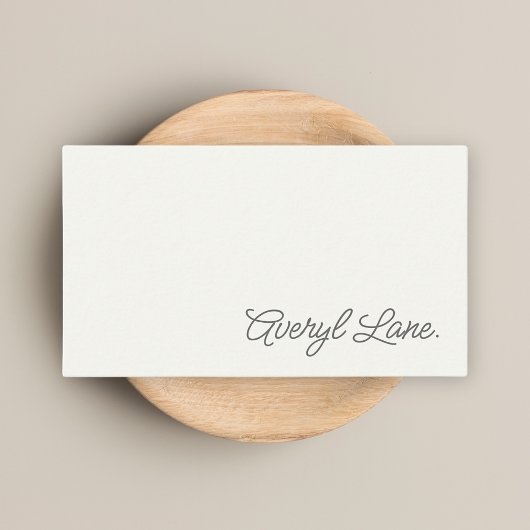 Minimalistische luxe boetiekivoor elegant script visitekaartje