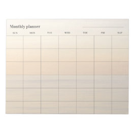 Minimalistische maandelijkse planner (pastel), aan notitieblok