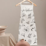 Minimalistische moderne witte zwarte bloem Geperso Schort<br><div class="desc">Houdt ze van strakke lijnen en hedendaags design? Geef haar een gepersonaliseerd schort om haar prachtige keuken te matchen met dit zwart-witte Schort. Met op maat geïllustreerde lijnkunstbloemen voor een gestroomlijnde en elegante look, past dit schort perfect bij een modern scriptlettertype met langstaartversieringen. Een doordacht geschenk voor degenen die eenvoud...</div>