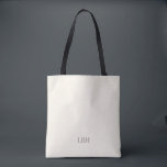Minimalistische Monogram Bruidsmeisje Canvas tas<br><div class="desc">Een geschenk dat ze overal zullen dragen - letterlijk. Deze ivoren canvas tas met een strak grijs monogram is ruim genoeg voor essentiële dingen op huwelijksdag en chique genoeg voor dagelijkse boodschappen. Een gepersonaliseerd bruidsmeisje cadeau dat is zo praktisch als het is mooi.</div>