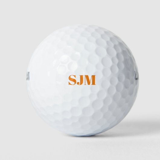 Minimalistische oranje aangepaste monogram initial golfballen (Voorkant)