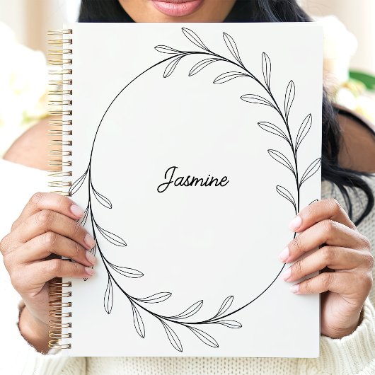 Minimalistische zwarte bladkrans met aangepaste na planner