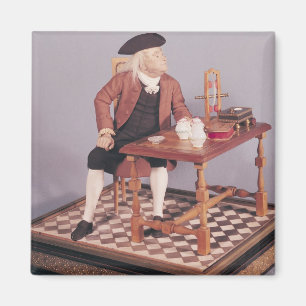 Model van Benjamin Franklin aan zijn tafel Magneet