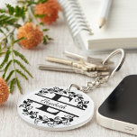 Modern Black Floral Wreath Split Monogram "E" Sleutelhanger<br><div class="desc">This refined floral split monogram wreath design features a delicate botanical arrangement forming a graceful circular frame around a customizable monogram "E". The balanced composition highlights elegant leaves and floral accents that create a timeless and sophisticated look. This acrylic double sided keychain is perfect for personalized gifts, wedding favors, accessories,...</div>