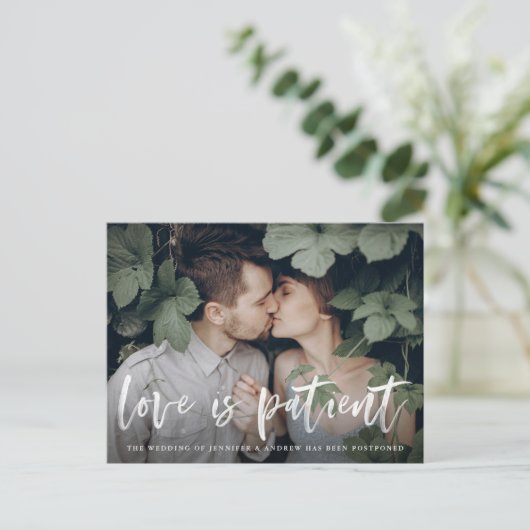 Modern Brush Script Love is Patient Postponement Aankondigingskaart (Staand voorkant)