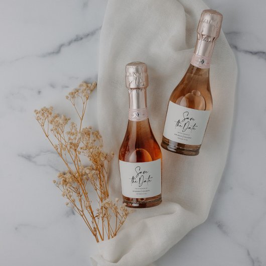 Modern casual script black save the date wedding sparkling wijnetiket