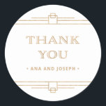 Modern Deco | Elegant Faux Gold and White Wedding Ronde Sticker<br><div class="desc">Deze glamoureuze trouwstickers zijn voorzien van een moderne spion op een klassiek kunstdeco. ,  faux goud ziet er geometrische grenzen uit en versiering versiert een elegante witte achtergrond voor een dramatisch,  vintage bruiloft. Klassieke faux gouden typografie zegt "dank je",  waardoor deze perfect zijn om je huwelijksgunsten aan te vullen.</div>
