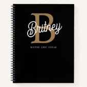 Modern Elegant Monogram Naam Zwart Goud Script Notitieboek (Voorkant)