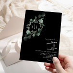 Modern Greenery Black Monogram Wedding Kaart<br><div class="desc">Dit moderne zwarte monogram bruinkoolmonogram huwelijksuitnodigingsontwerp biedt een eenvoudige mix en past coördinerende stijlen in zwart-wit aan met delicate groene elementen, waardoor de bloei van het monogram gemakkelijk kan worden getitreerd en het fraaie, minimale kalligrafiemanuscript kan worden aangepast. De waterverf eucalyptus en andere botanische bladeren zijn prachtig doorheen, met donkere...</div>