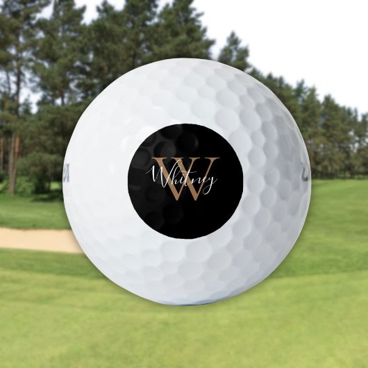 Modern zwart en goud monogram scriptnaam golfballen