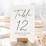 Modern Zwart Script Trouwtafel Nummer Kaart<br><div class="desc">Eenvoudige, moderne bruidstafel nummerkaarten met "Tafel" weergegeven in een handgeschreven zwart script met een witte achtergrond (of een kleur naar keuze). Om de zwarte en witte tafelkaarten te bestellen: voeg jouw namen, trouwdatum en tabelnummer toe. Elk nummer moet afzonderlijk aan uw winkelwagen worden toegevoegd. Nadat u klaar bent met het...</div>