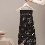 Modern Zwart Wit Bloemen lineart gepersonaliseerd Schort<br><div class="desc">Verhoog uw keukenstijl met dit Modern Black White Floral Line Art Personalized Schort. Met een strak, minimalistisch zwart-wit bloemlijnontwerp brengt dit schort elegantie en sophisticatie in elke kook- of bakervaring. Pas het aan met jouw naam, waardoor het het perfecte gepersonaliseerde geschenk is voor bakkers, chef-koks of iedereen die graag tijd...</div>
