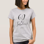 Moderne 60 Fabulous Custom Name 60th Birthday Gift T-shirt<br><div class="desc">Vier het draaien 60 in stijl met deze aangepaste naam modern 60e verjaardag t-shirt met de tekst 60 en fantastisch in elegant zwart script. Voeg eenvoudig jouw naam toe aan dit 60ste verjaardagsviering t-shirt. Perfect verjaardagscadeau voor een moderne, stijlvolle en elegante 60-jarige. Exclusief voor u ontworpen door Happy Dolphin Studio....</div>