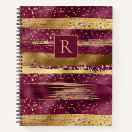 Moderne bogundy, gouden borstelstrokken en monogra notitieboek