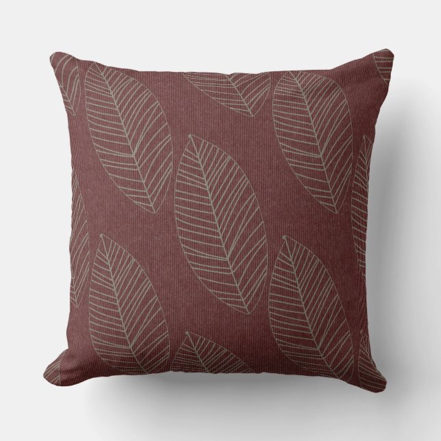 Moderne boho botanische bladeren op diep rode stof kussen (Voorkant)