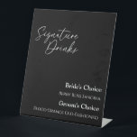 Moderne Classic Black Wedding Signature Drink Sign Reclamebord Met Voetstuk<br><div class="desc">Dit moderne klassieke zwarte bruiloft drink-bord is perfect voor je elegante moderne bruiloft. Dit ontwerp is voorzien van witte eenvoudige kalligrafie die op een donkere zwarte achtergrond is geplaatst om te passen aan uw klassieke bruiloft of minimalistische boho bruiloft in de lente, zomer, herfst of winter. Geef ons alstublieft de...</div>