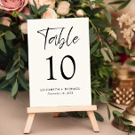 Moderne Crème Bruiloft Receptie Kaart<br><div class="desc">Modern licht crème bruiloft receptie tafel nummer teken met "Tabel" in een chique script, het tafelnummer in elegante serif typografie, en uw namen en de ontvangstdatum in eenvoudige typografie. Creëer Elk tabelnummer en voeg één voor één toe aan uw winkelwagentje en bekijk het als alle nummers in uw winkelwagentje staan....</div>