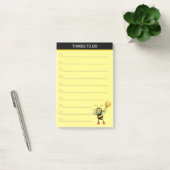 Moderne cute honingbij op zwart en geel post-it® notes (Kantoor)