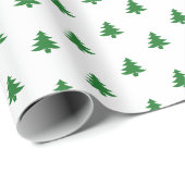 Moderne, eenvoudige, groene kerstbomen op wit cadeaupapier (Rol Hoek)