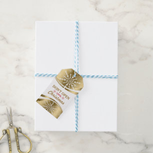 Moderne geometrische gouden en witte kerstsnowflak cadeaulabel