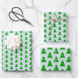 Moderne geometrische kerstbomen op groen op blauw inpakpapier vel