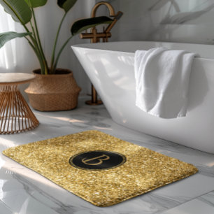 Moderne gouden glitter textuur met monogram badmat