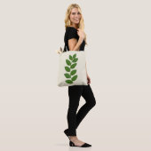Moderne groene plantenbladeren tote bag (Op model)