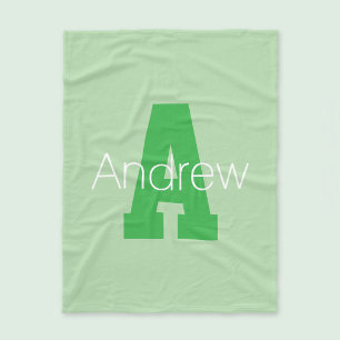 Moderne hoofdletter in bledgroen en lichtgroen fleece deken