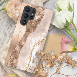 Moderne Ivory Agaat & Roos Gouden Glitter Monogram Samsung Galaxy Hoesje<br><div class="desc">Verbeter de elegantie van uw telefoon met onze prachtige "Modern Ivory Agaat & Roos Gold Glitter Monogram Samsung Galaxy S22 Ultra Hoesje". Dit verfijnde hoesje is voorzien van een boeiende mix van ivoorkleurige champagneagaatontwerpen en sprankelende gouden glitteraccenten van roos, waardoor een luxueuze en gepersonaliseerde look wordt gecreëerd. Bescherm uw telefoon...</div>