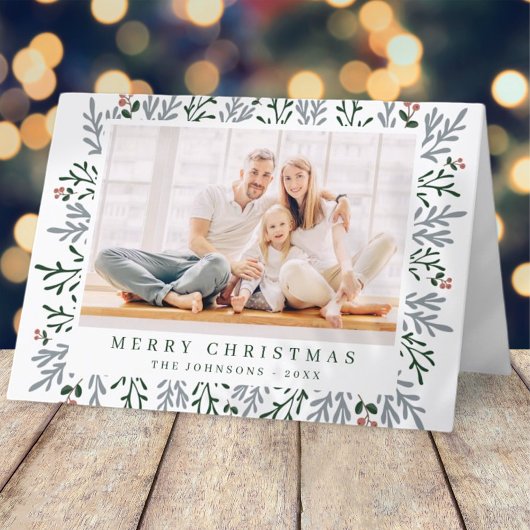 Moderne kerstavond en botanische bessen feestdagen kaart