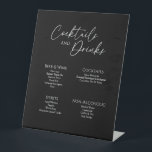 Moderne klassieke Drink met zwarte bruiloft Reclamebord Met Voetstuk<br><div class="desc">Dit moderne klassieke zwarte trouwlintje is perfect voor je elegante moderne bruiloft. Dit ontwerp is voorzien van witte eenvoudige kalligrafie die op een donkere zwarte achtergrond is geplaatst om te passen aan uw klassieke bruiloft of minimalistische boho bruiloft in de lente, zomer, herfst of winter. Geef ons alstublieft de vrijheid...</div>