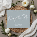 Moderne minimale blauwe wijzig de datum bekendmaki briefkaart<br><div class="desc">Aangepast ontworpen bruiloft uitstel/verandering het date briefkaart met modern wit handschrift op stoffige blauwe achtergrond.</div>