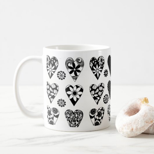 Moderne minimalistische harten en bloemen zwart en koffiemok (Met donut)