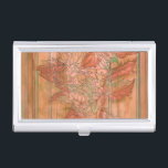 Moderne Oranje Floral Print op gestripte achtergro Visitekaarthouder<br><div class="desc">Een Jennifer Goldberger originele schepping,  deze moderne oranje bloemdruk zit op een gestripte achtergrond. De bloemen mengen bijna met de achtergrond. Laat het zich mengen met de rest van je huis door het vandaag te kopen!</div>